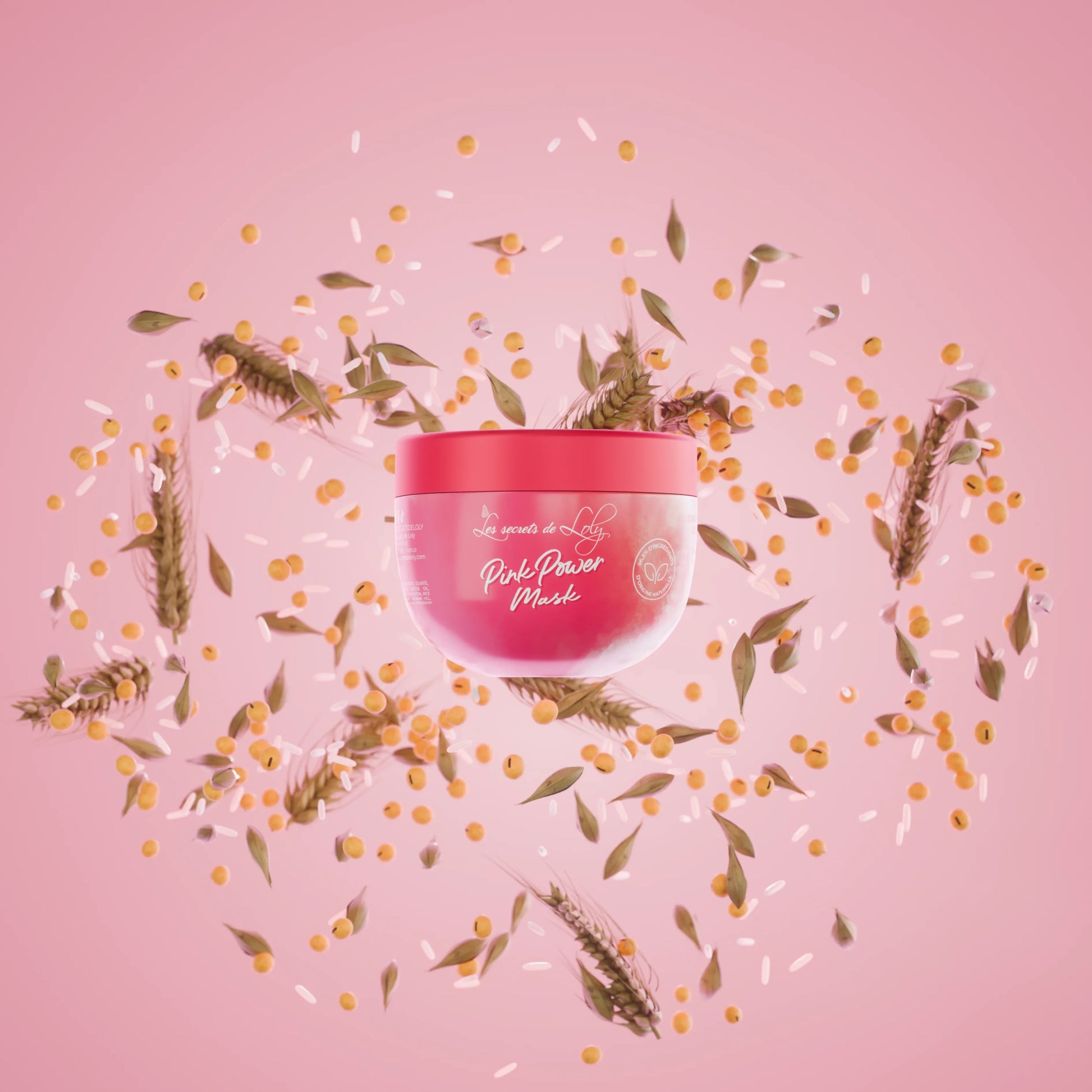 Pink Power Mask hair treatment jar with grains, leaves, and seeds on a pink background