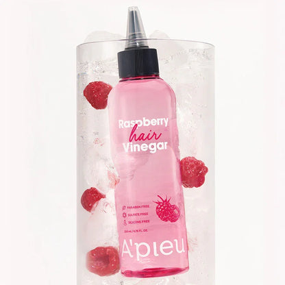 A'Pieu Raspberry Hair Vinegar bottle in ice with raspberries, hair care product