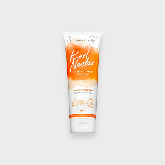 Kurl Nectar hair primer tube with orange and white design on a light background