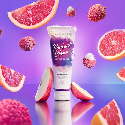 Perfect Clean Shampooing tube with grapefruit, lychee, and apple on a purple background