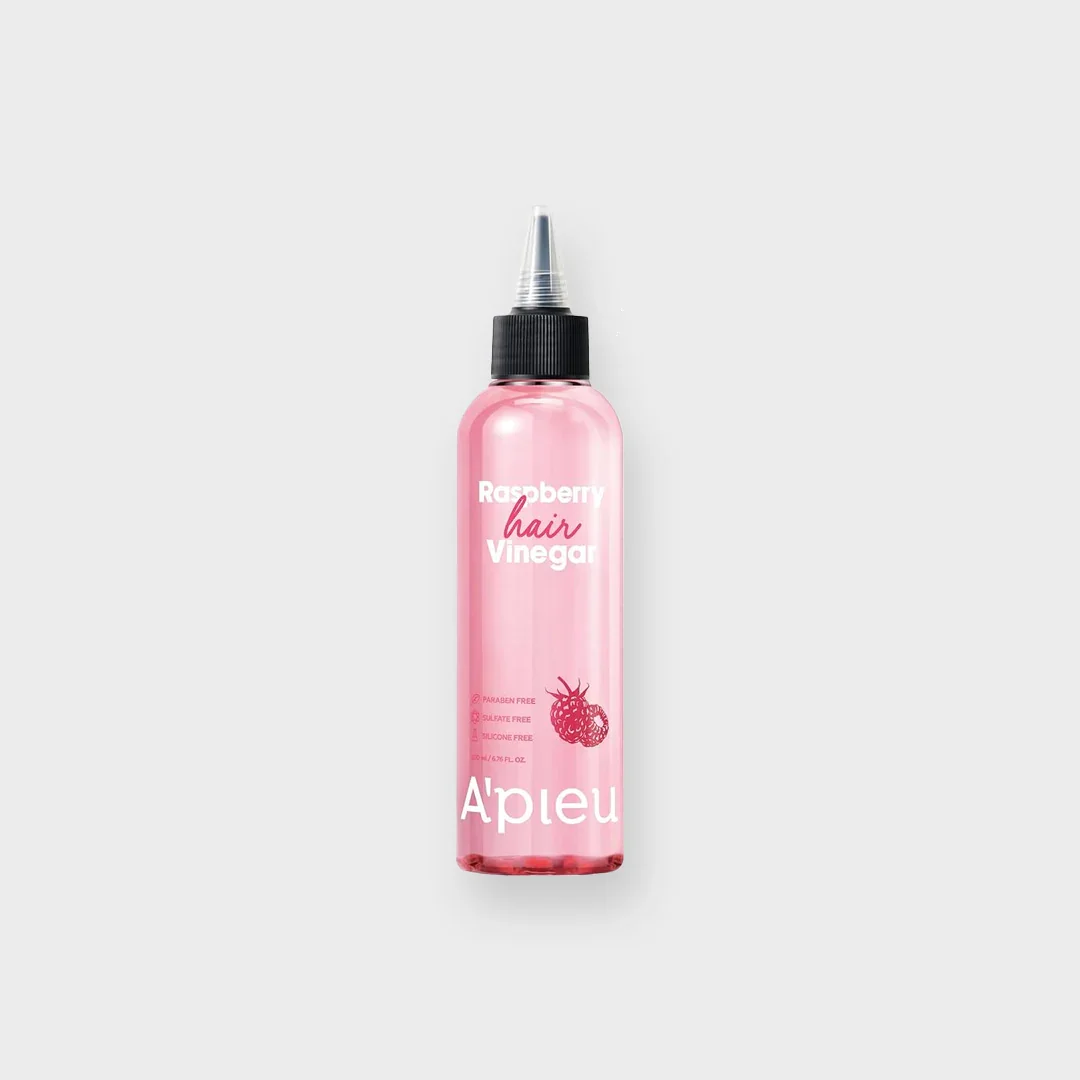 A'Pieu Raspberry Hair Vinegar pink bottle with black cap on white background